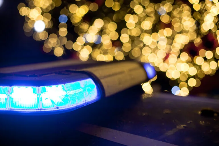 Christmas tree against Police car